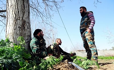 DAMASCUS, March 8, 2018 (Xinhua) -- Syrian soldiers are seen in the government-controlled Mlaiha town in Eastern Ghouta, Syria, on March 8, 2018. The Syrian government on Thursday prepared a second humanitarian corridor for evacuating civilians from the rebel-held areas in Eastern Ghouta, the state-run Ekhbaria TV reported. (Xinhua/Ammar Safarjalani/IANS)