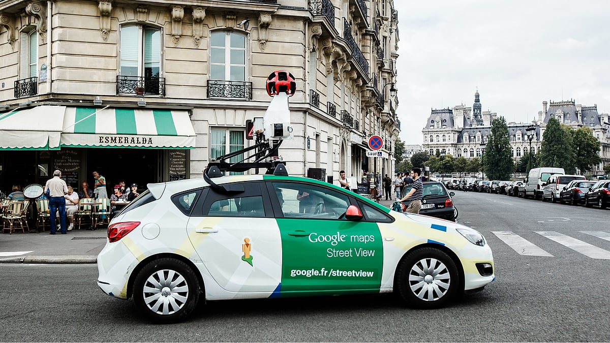 A Google Street View car on the streets of Paris. It uses a camera rig comprising of 9 directional cameras for a 360 degree view of the world around it. 