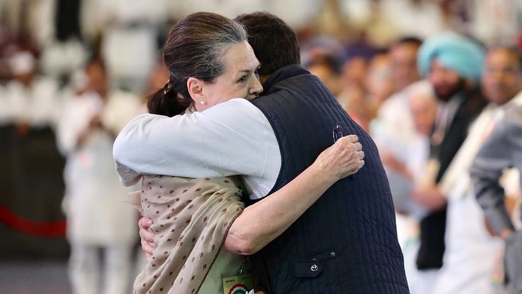 UPA chairperson and former Congress President Sonia Gandhi hugging her son and party President Rahul Gandhi after her speech.