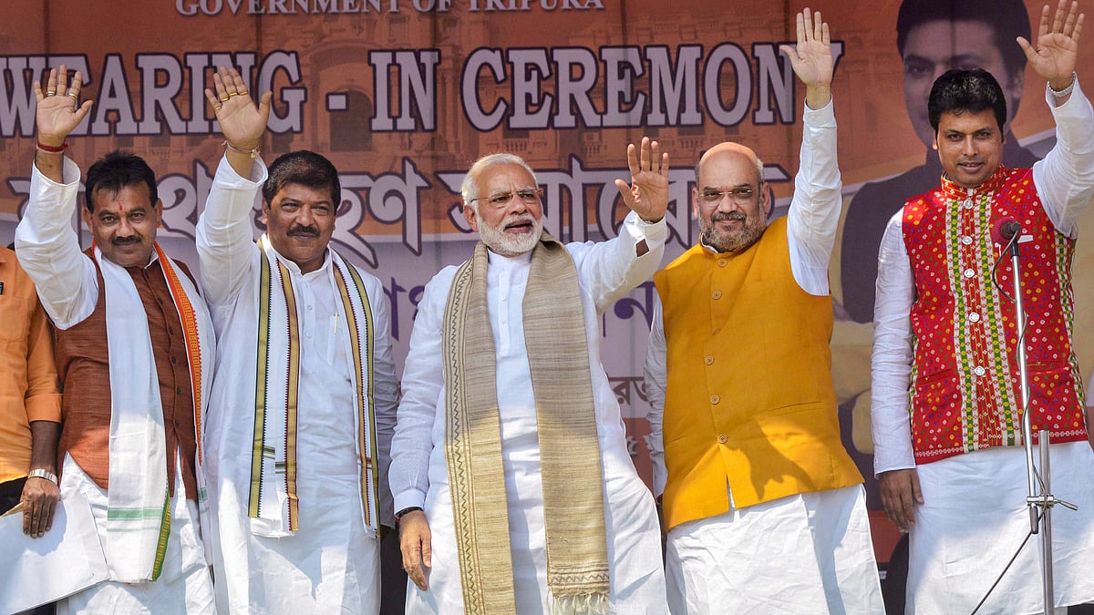 Prime Minister Narendra Modi with Bharatiya Janata Party (BJP) National President Amit Shah, new Tripura Chief Minister Biplab Kumar Deb and others during the swearing-in ceremony of the newly elected ministers , in Agartala on Friday. 
