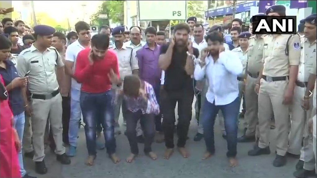 The four rape accused were paraded by the police on the streets of Bhopal.