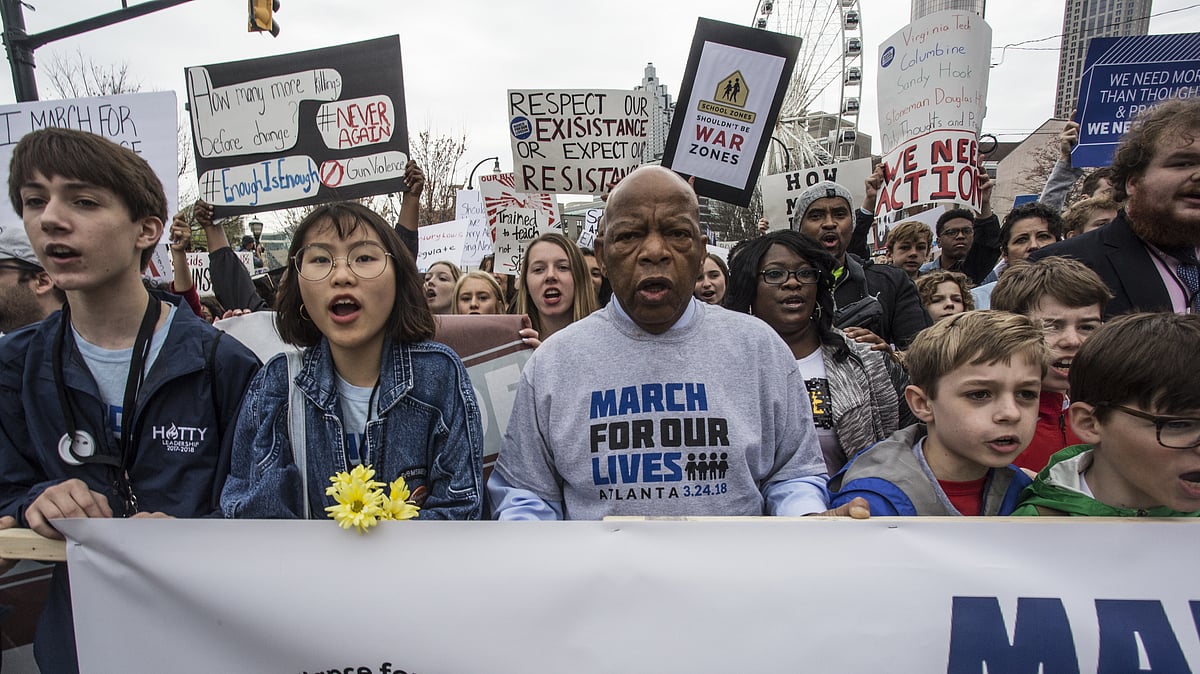 US Representative John Lewis leads a march of thousands through the streets of Atlanta, Georgia on 24 March. Participants in Atlanta and across the nation rallied against gun violence and in support of stricter gun control. 