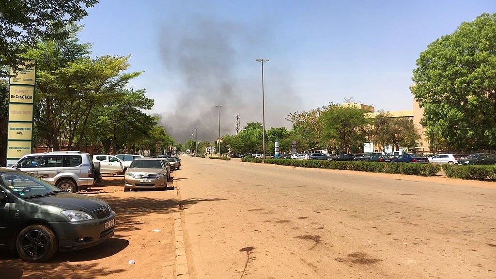 Smoke can be seen rising in the distance in central Ouagadougou, Burkina Faso, Friday 2 March 2018. 