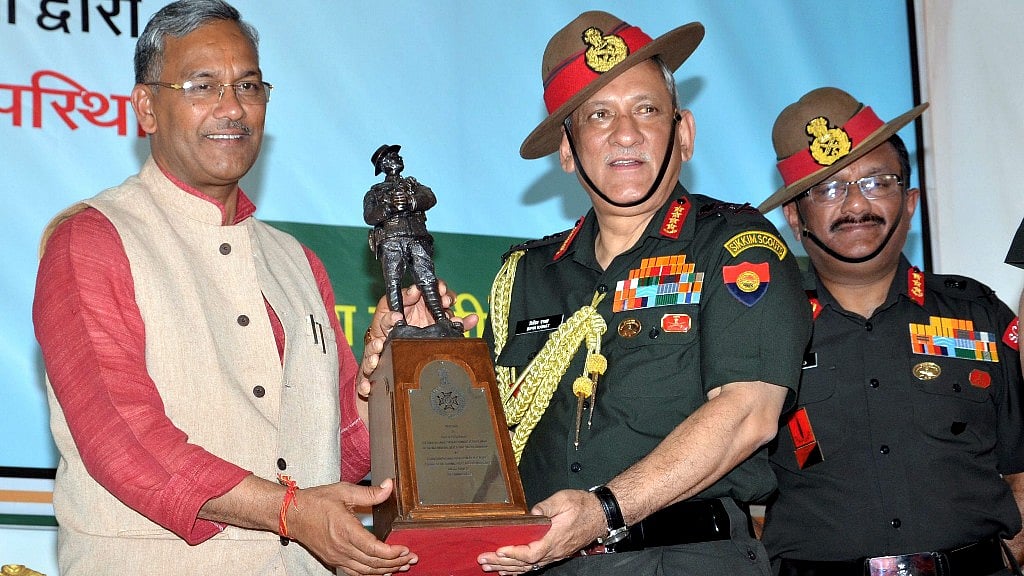 Chief of Army Staff General Bipin Rawat presents a memento to Uttarakhand Chief Minister Trivendra Singh Rawat, in Dehradun on Sunday.