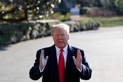 WASHINGTON D.C., March 13, 2018 (Xinhua) -- U.S. President Donald Trump answers questions from the press before departing the White House in Washington D.C., the United States, on March 13, 2018. U.S. President Donald Trump on Tuesday announced he was replacing Secretary of State Rex Tillerson with Mike Pompeo, chief of the Central Intelligence Agency (CIA). (Xinhua/Ting Shen/IANS)