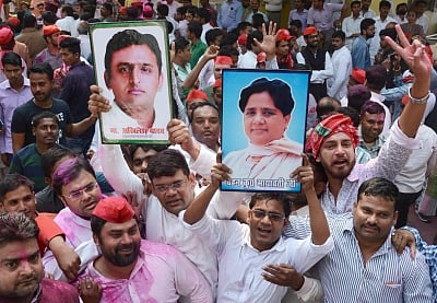 Lucknow: Samajwadi Party (SP) and Bahujan Samaj Party (BSP) workers celebrate, outside SP office in Lucknow on March 14, 2018. SP on Wednesday took winning leads in both the Lok Sabha seats of Gorakhpur and Phulpur. With BSP backing its bitter rival SP, BJP appeared to be heading for a shock defeat. (Photo: IANS)