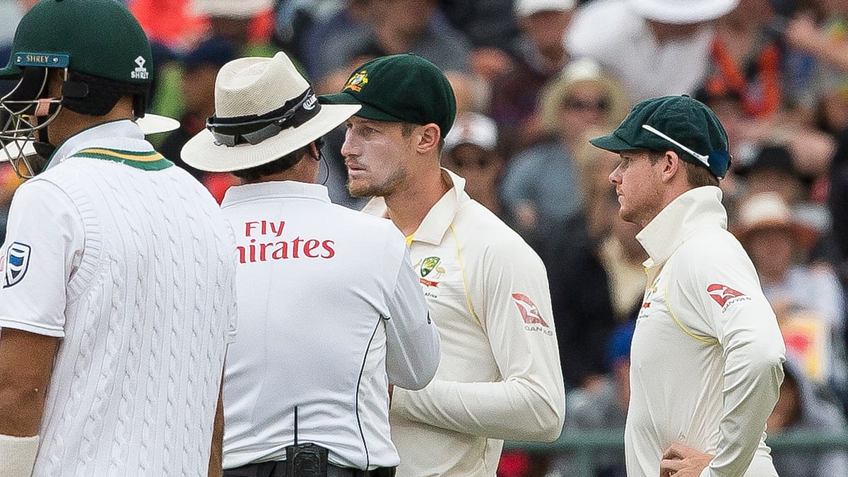 Cameron Bancroft of Australia is questioned by umpires over ball tampering on the third day of the third cricket test between South Africa and Australia at Newlands Stadium, in Cape Town, South Africa, Saturday, March 24, 2018. 