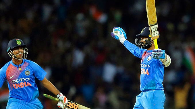 Dinesh Karthik celebrates after helping India defeat Bangladesh in the Nidahas Trophy T20 tri-series final.