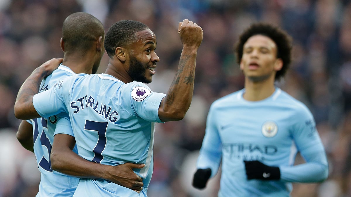 Manchester City’s Raheem Sterling, celebrates after teammate Manchester City’s Fernandinho, left, scored his side’s fourth goal.