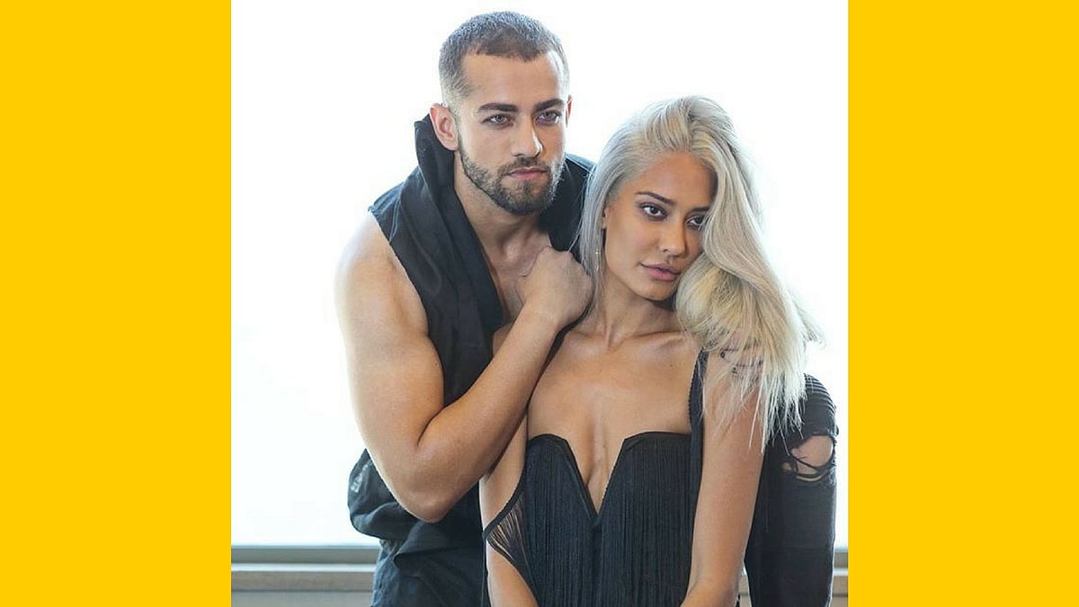 Lisa Haydon and Mahir Pandhi performing a task.