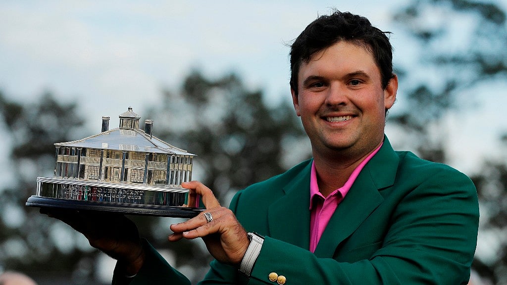 Patrick Reed holds the championship trophy after winning the Masters golf tournament in Augusta.
