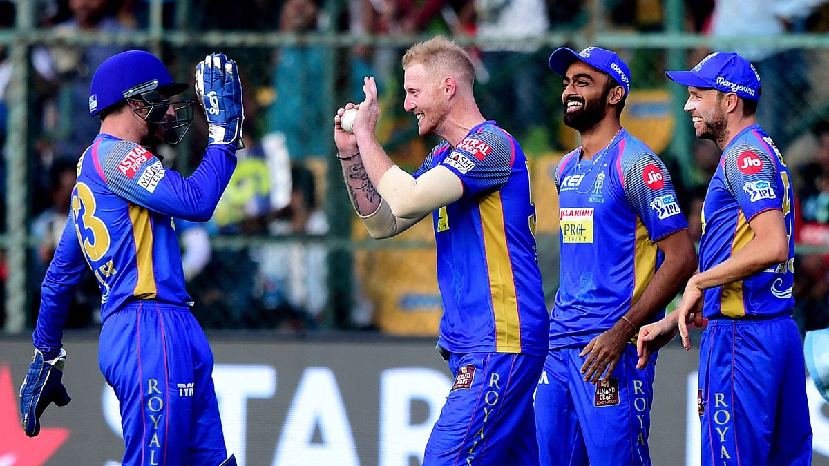 Rajasthan Royals Ben Stokes with team mates celebrates after taking catch off Royal Challengers Bangalores Brendon McCullam during the IPL 2018 cricket match at Chinnaswamy Stadium in Bengaluru on Sunday.&nbsp;