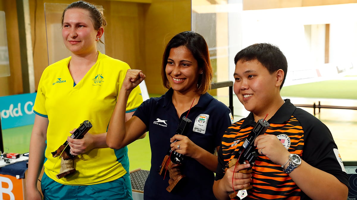 Gold medalist Heena Sidhu of India, silver medalist Elena Galiabovitch of Australia and bronze medalist Alia Sazana Azahari of Malaysia. 