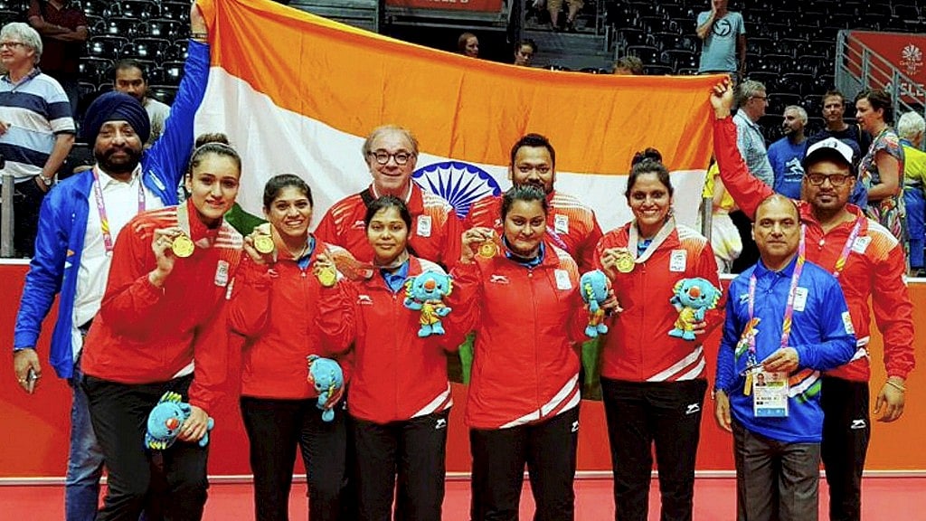 Indian Women’s table tennis team with their gold medal at the Commonwealth Games.