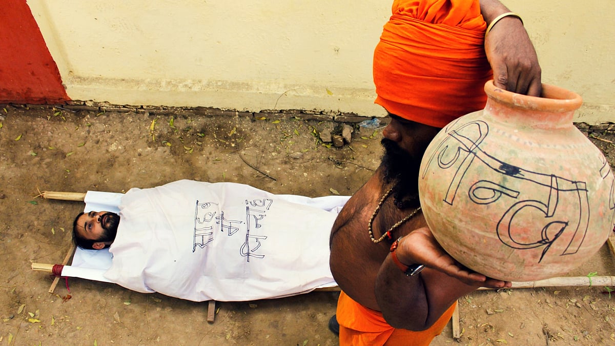 Santosh Singh lies in protest.