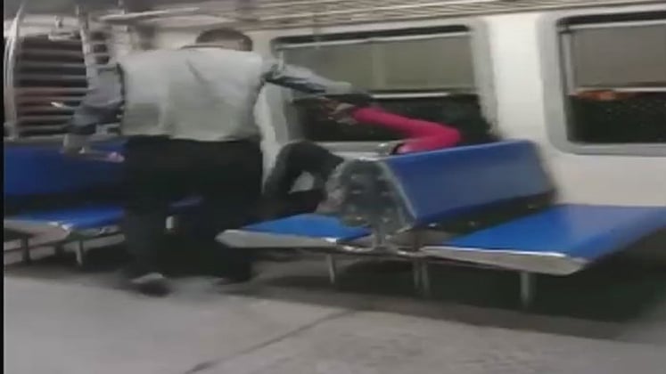 A visual from the amateur video that captured the horrific incident of a passenger being molested on a Mumbai local.