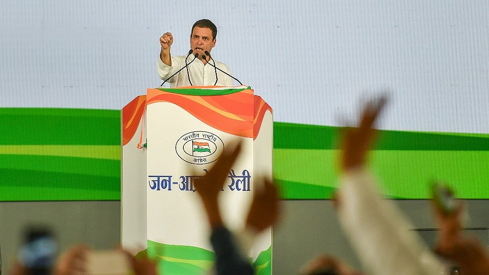 Congress President Rahul Gandhi addresses during Jan Akrosh Rally, in New Delhi on Sunday.