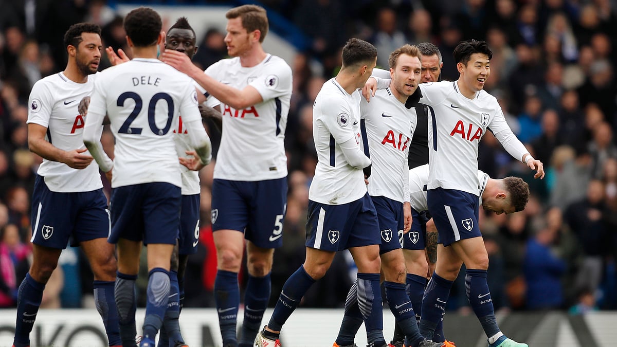 Tottenham players celebrate after scoring their first goal during their match against Chelsea at Stamford Bridge on Sunday.