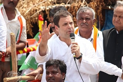 Malur: Congress President Rahul Gandhi addresses during a road show ahead of Karnataka Polls at Malur in Kolar district of Karnataka on May 7, 2018. (Photo: IANS)