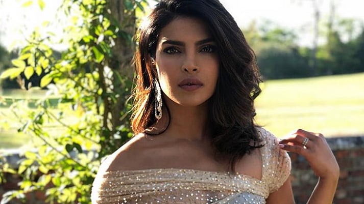 Priyanka Chopra wore a sparkling gown by Dior at Meghan Markle and Prince Harry’s royal wedding reception.