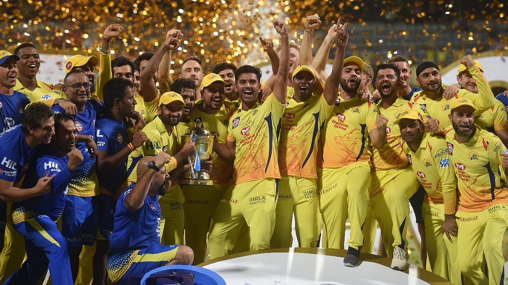 Chennai Super Kings players celebrate with the IPL 2018 trophy after winning the final match against Sunrisers Hyderabad, in Mumbai. 