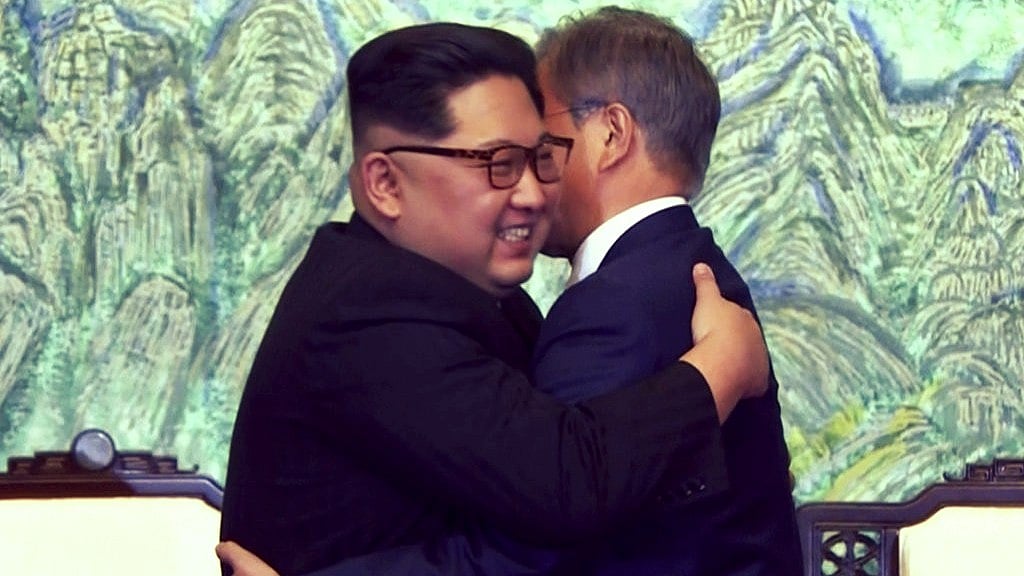 North Korean leader Kim Jong Un, left, and South Korean President Moon Jae-in embrace each other after signing on a joint statement at the border village of Panmunjom in the Demilitarised Zone.