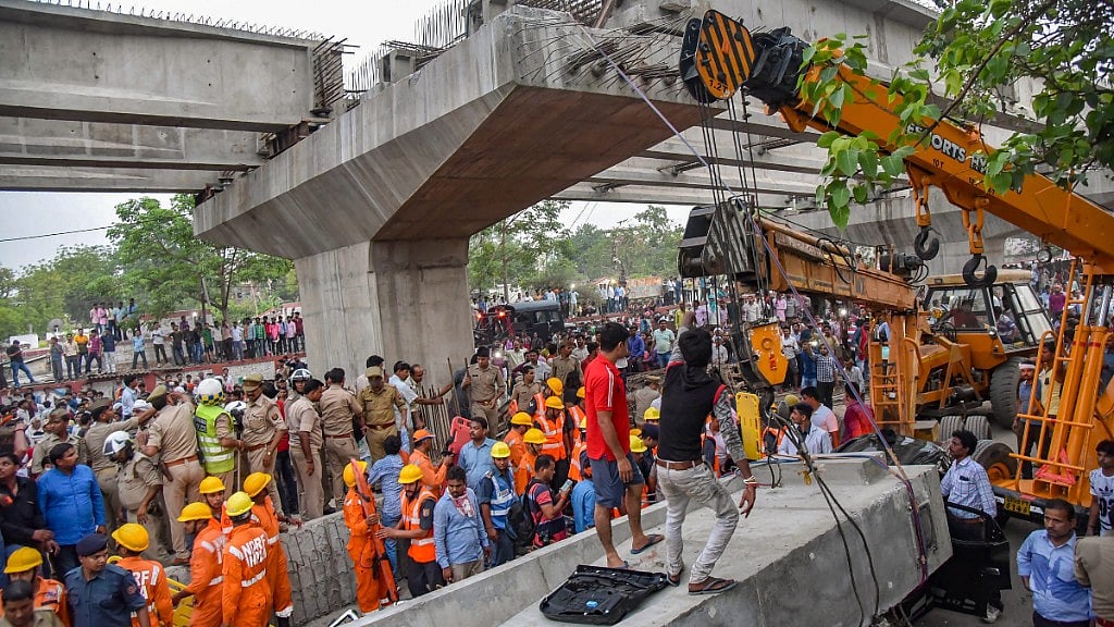 At least 18 people were killed and several trapped under the rubble after a portion of an under-construction flyover collapsed in Varanasi.