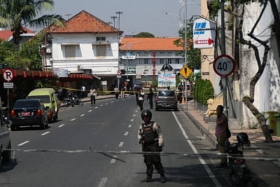 SURABAYA, May 14, 2018 (Xinhua) Indonesian police officers secure the area following a bomb blast at Surabaya