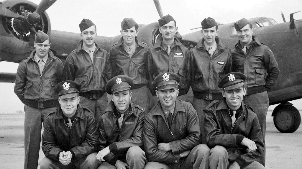 This circa 1943 US Army Air Force photo from the Kelly Family Research Project shows Lt Tom Kelly (lower right) and other members of his crew of the B-24 bomber. 