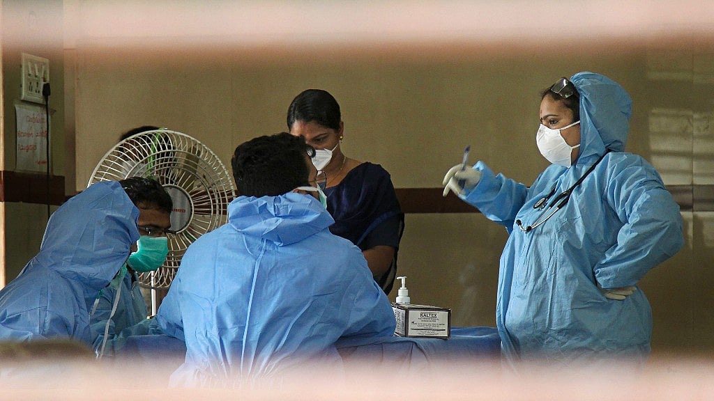 Hospital staff wears safety masks as a precautionary measure at the Kozhikode Medical College after the Nipah virus outbreak.