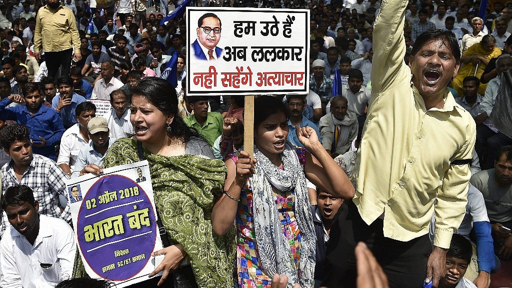 Members of the Dalit community raise slogans during Bharat Bandh against the alleged dilution of SC/ST Act in New Delhi. 