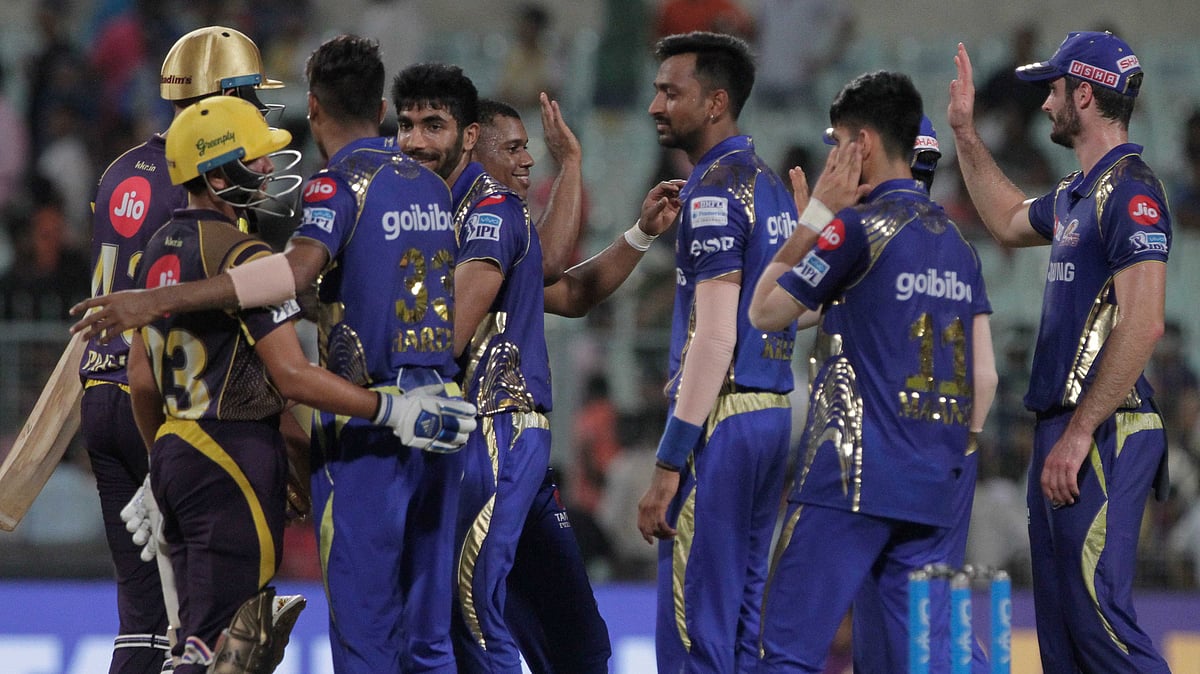 Kolkata Knight Riders’ Kuldeep Yadav, left and Prasidh Krishna shake hands with players of Mumbai Indians’ at the end of game during the VIVO IPL cricket T20 match in Kolkata, India, Wednesday, May 9, 2018.