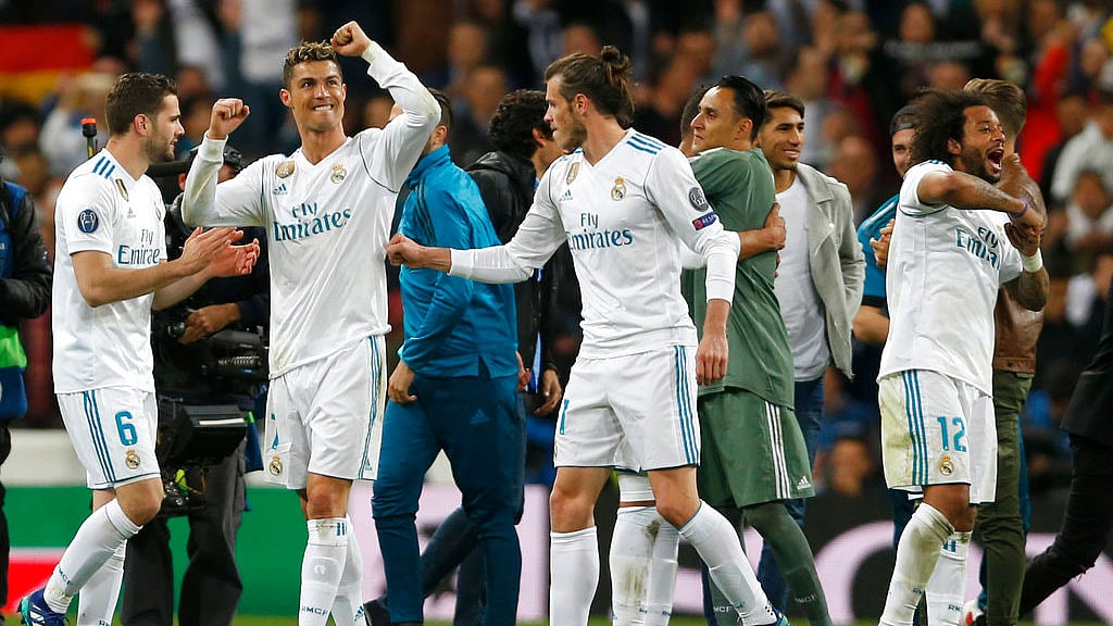 Cristiano Ronaldo celebrates with his teammates after Real Madrid reached their third straight Champions League final.