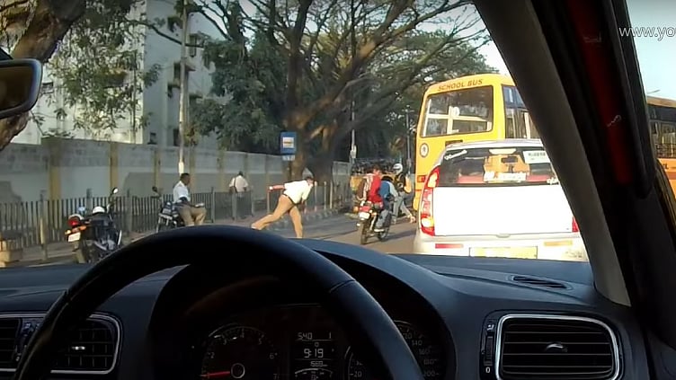 The constable was spotted throwing his shoe at the riders in Bangalore’s BEL Road. 
