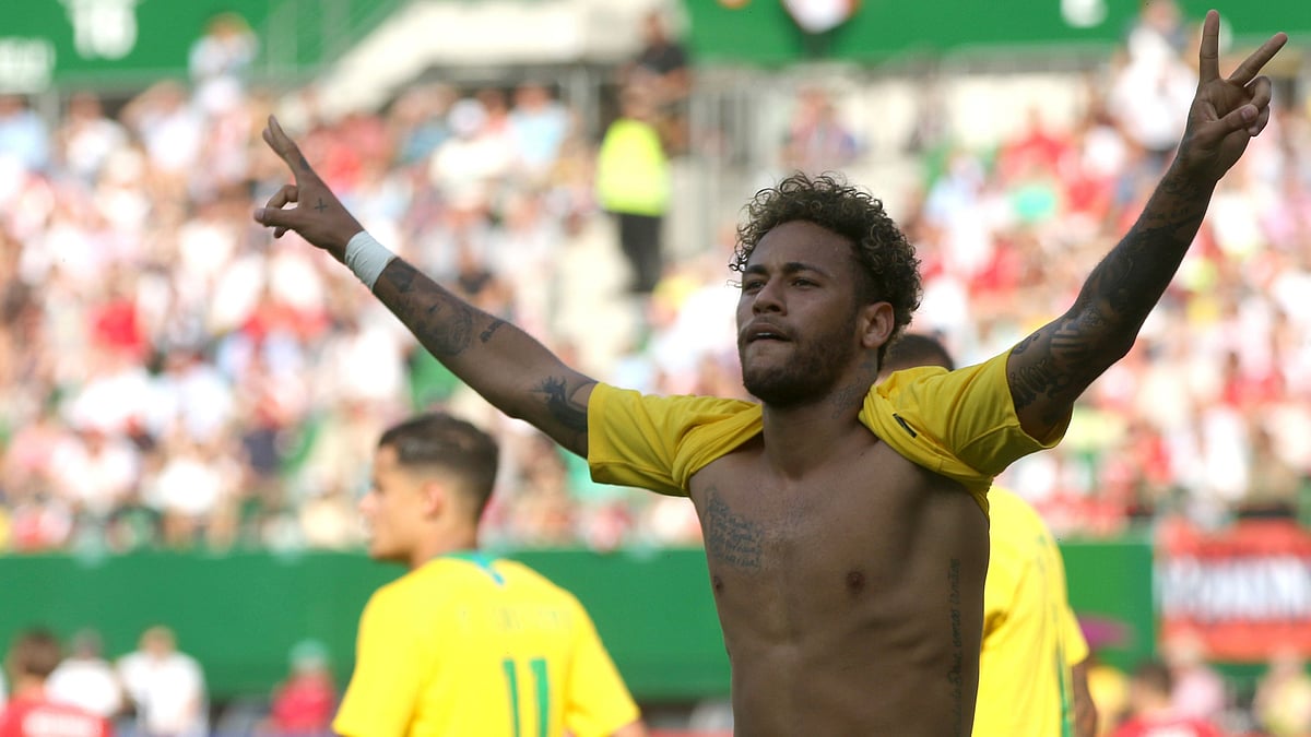 Brazil’s Neymar celebrates after scoring his side’s second goal during a friendly soccer match between Austria and Brazil.