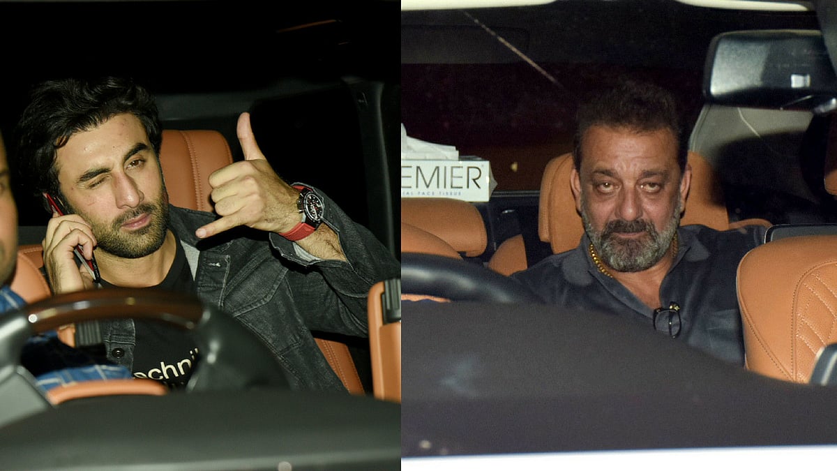 Ranbir Kapoor and Sanjay Dutt arrive at the <i>Sanju </i>screening in Mumbai.