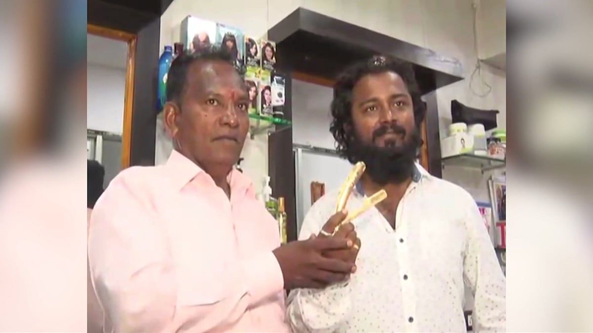 Ram Chandra Kashid, who runs Ustara Men’s Salon in Sangli, Maharashtra shaves with a golden razor