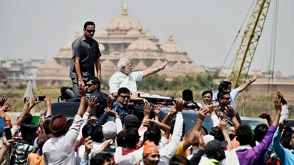 PM Modi during a roadshow to inaugurate the Delhi-Meerut Expressway on 27 May, 2018. 