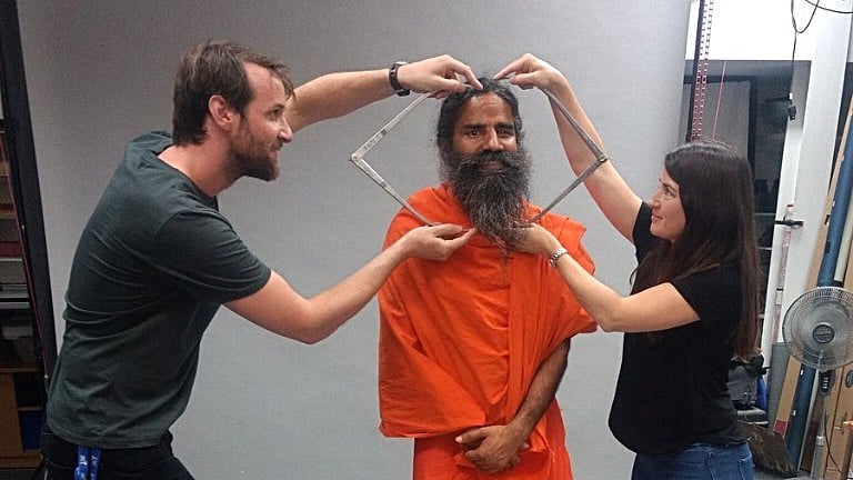 Yoga Guru Baba Ramdev giving measurements for his wax statue in London. 