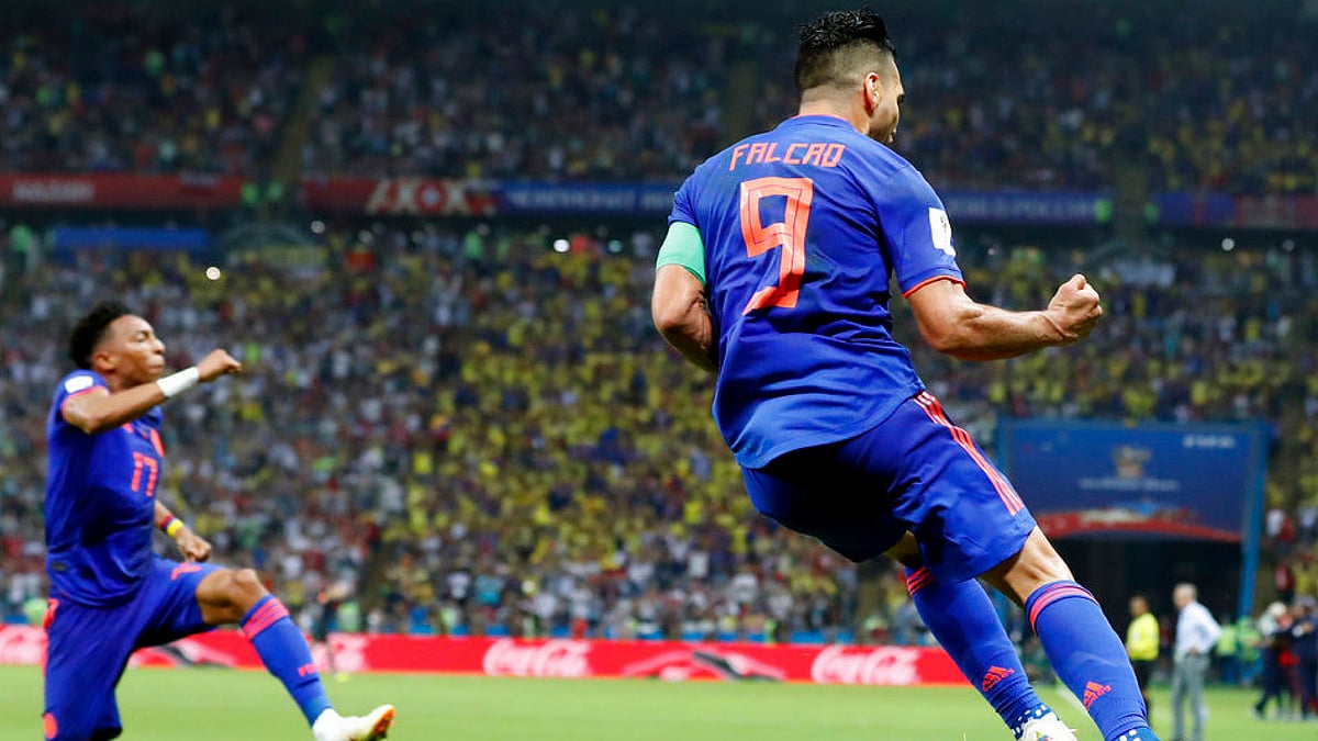 Colombia’s Radamel Falcao (right) celebrates after scoring the second side goal past Poland goalkeeper Wojciech Szczesny during the Group H match 