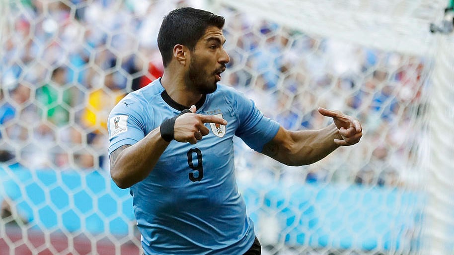 Luis Suarez celebrates after scoring a goal against Saudi Arabia.