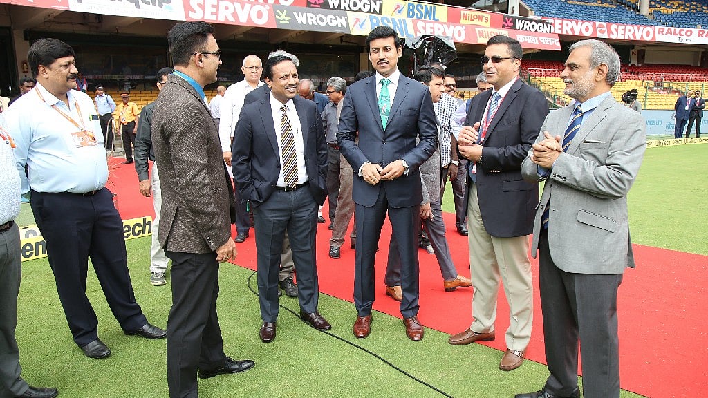 Union Sports Minister Rajyavardhan Singh Rathore with BCCI CEO Rahul Johri during Day One of the Test match between India and Afghanistan in Bengaluru on 14 June.