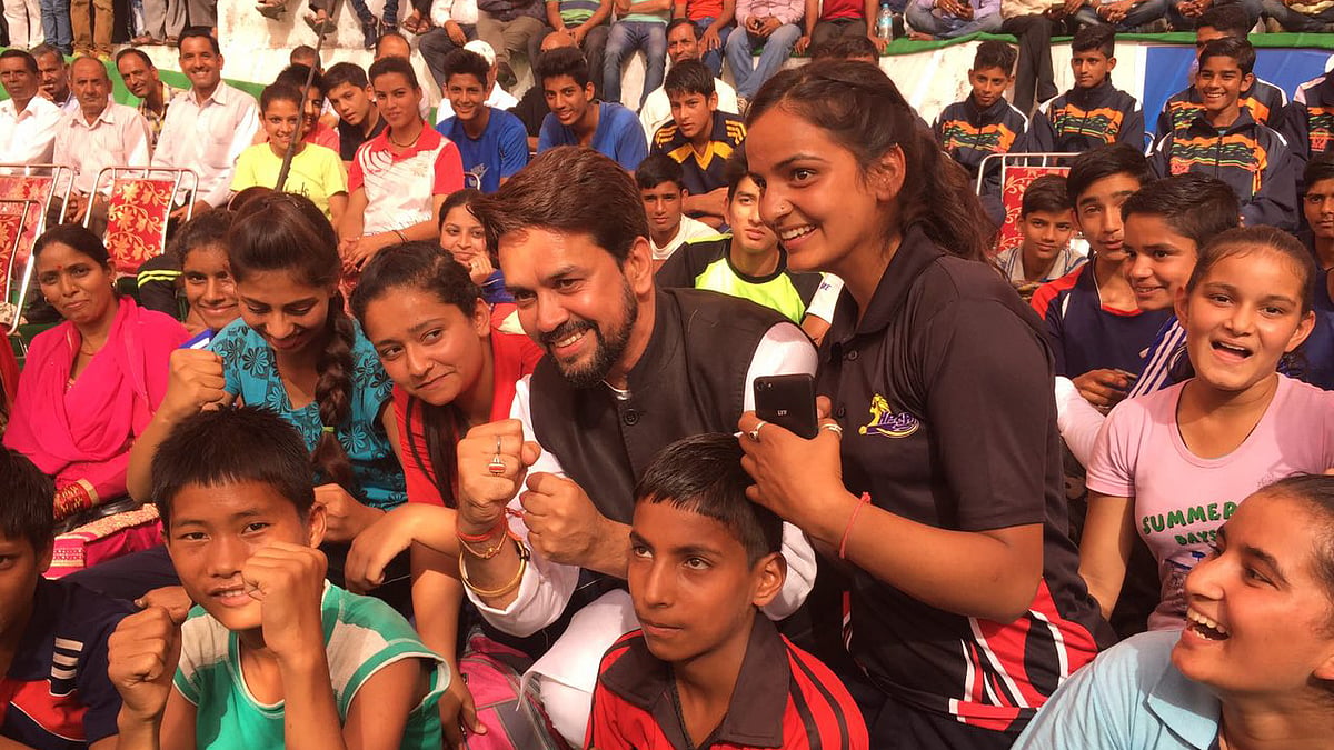 Anurag Thakur with young athletes.