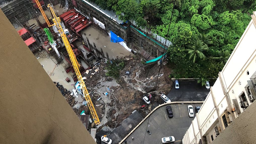 A portion of the wall caved in after heavy rains in Mumbai.