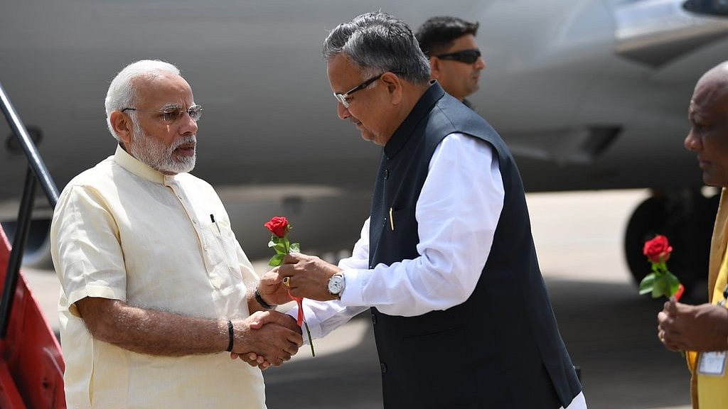 Chhattisgarh CM Raman Singh receives Prime Minister Narendra Modi in Raipur.
