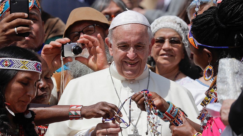 Pope Francis is given bracelets as he meets with some of the participants of the Spirit of The Planet Festival.