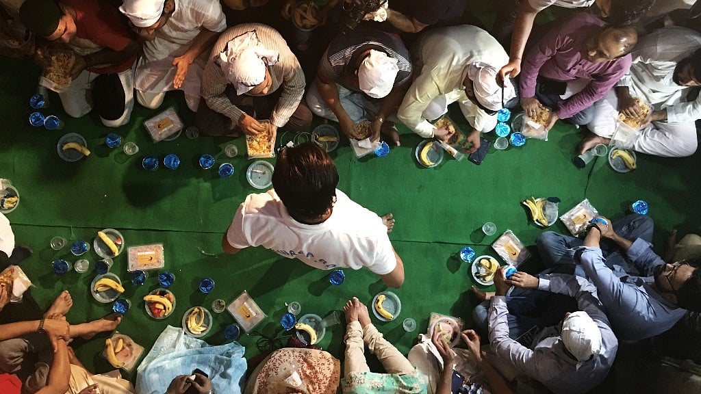 Friends, neighbours and well wishers join Ankit Saxena’s family for Iftar.