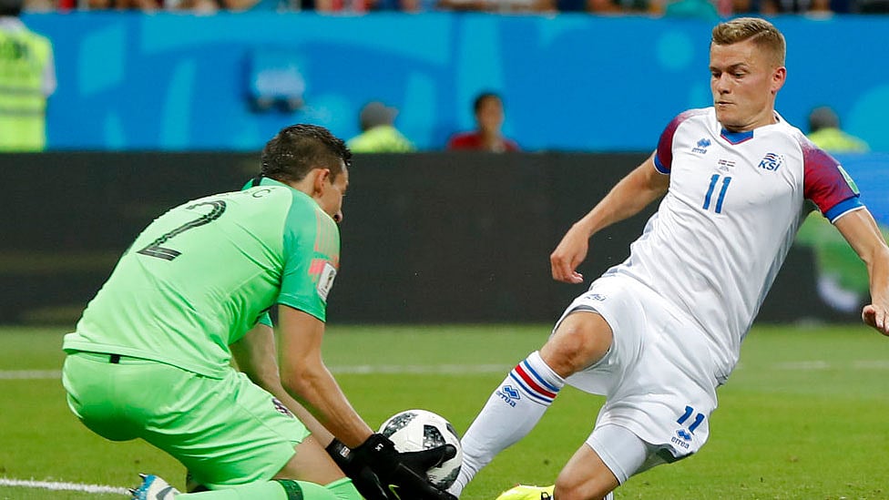 Croatia goalkeeper Lovre Kalinic, left, and Iceland’s Alfred Finnbogason fight for the ball during their group match.&nbsp;