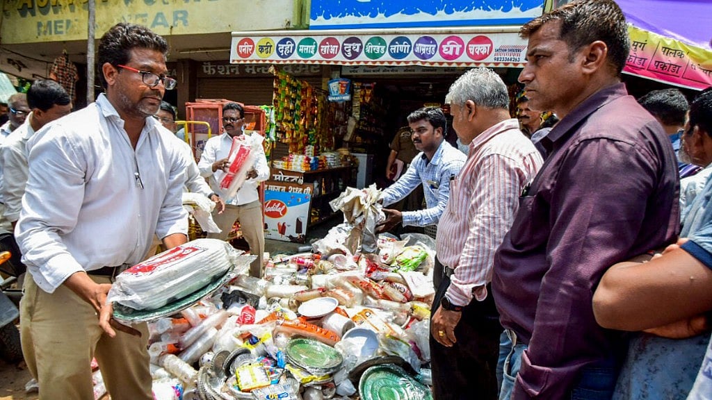 Nagpur Municipal Corporation (NMC) worker seize plastic material at a shop during an inspection following a plastic ban, in Nagpur on Saturday, 23 June 2018.