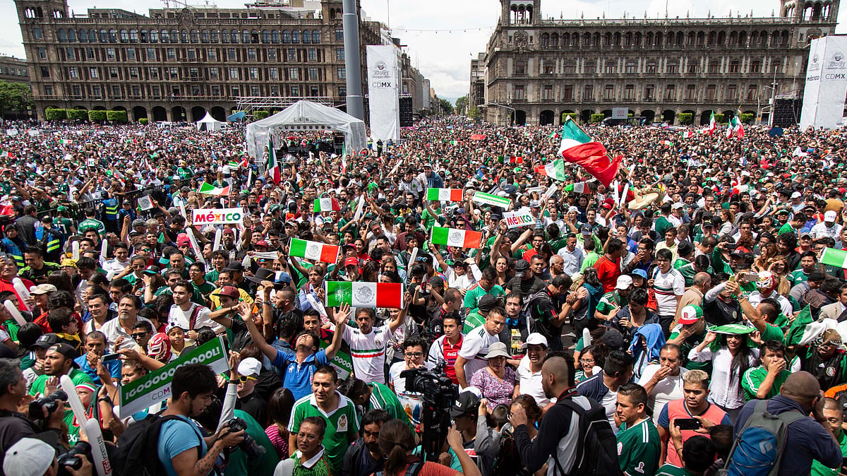 Fans celebrate Mexico’s win during the Mexico vs Germany World Cup in Mexico City, on 17 June.